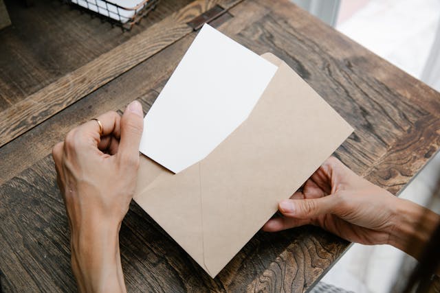 putting-paper-in-envelope